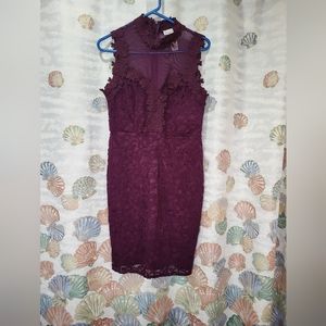 Beautiful Love Fast Live Hard lacy plum dress. With a choke collar.